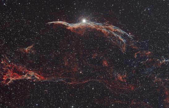 Stunning image of the Veil Nebula in deep space with vivid star field.