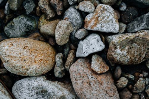 Free Detailed close-up image showcasing various textured stones and minerals. Stock Photo
