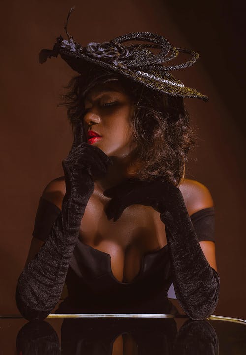 African American Woman Fashion Model in Black Hat and Tight Dress