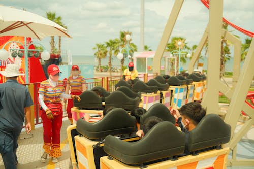 Attendants Checking the People Sitting on the Amusement Ride