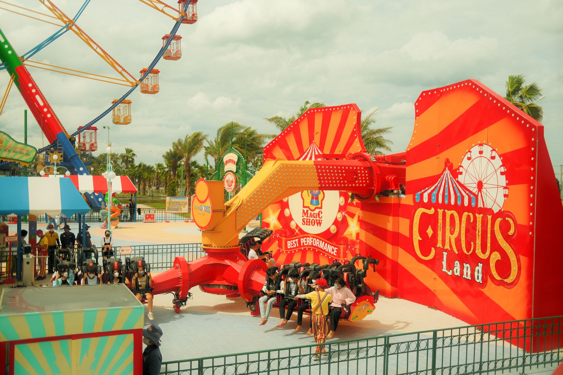 Colorful amusement park scene with people enjoying a thrilling ride at Circus Land.