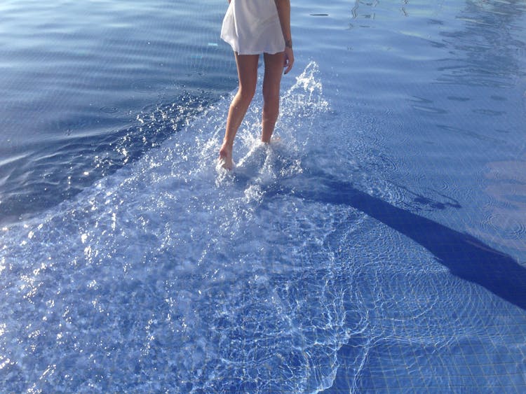 Attractive Woman Walking In Water