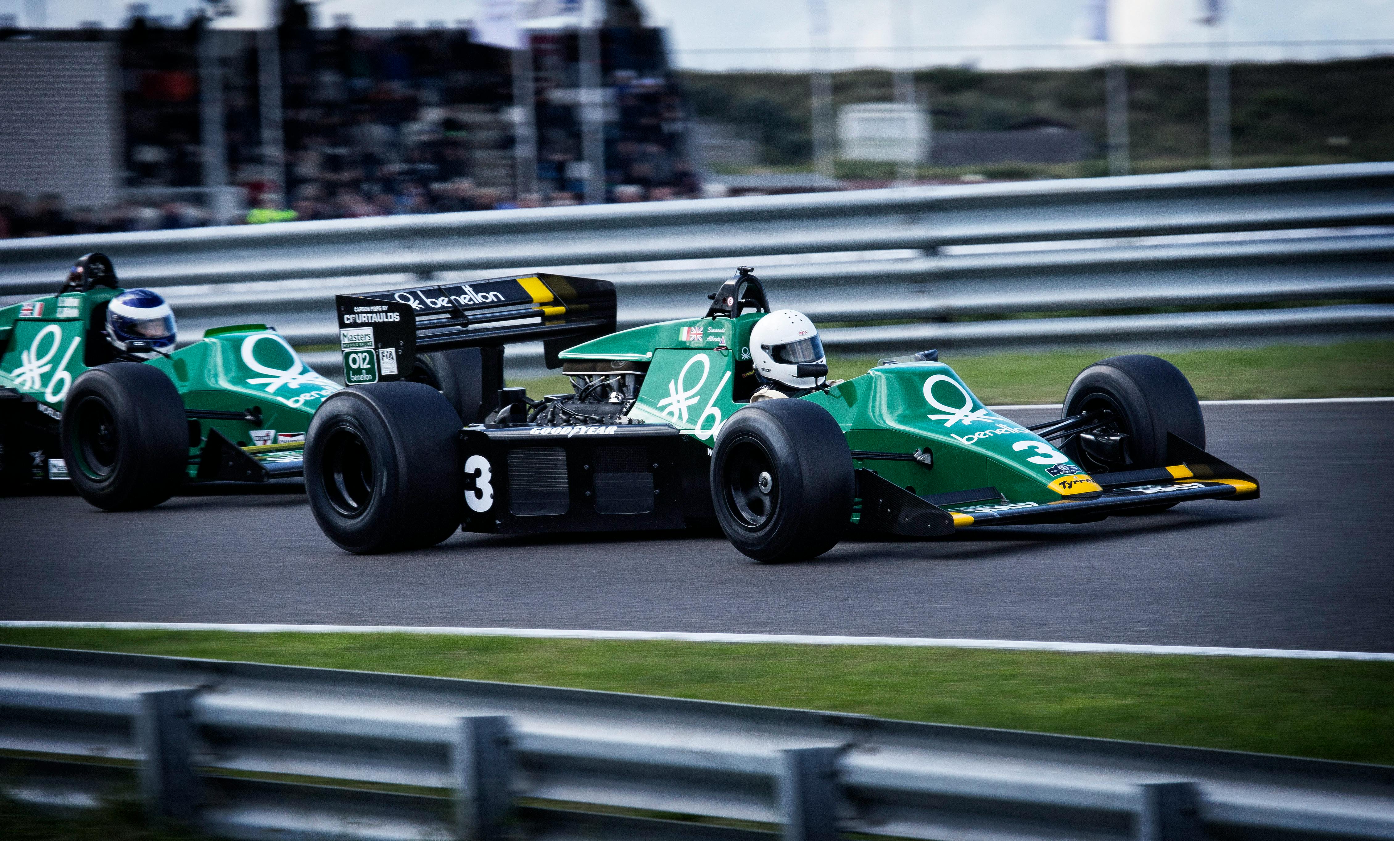 man riding on racing car