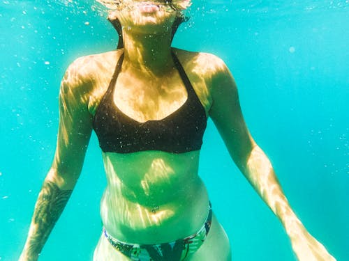 Woman in Swimming Costume Underwater