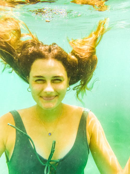 Woman Smiling under Water