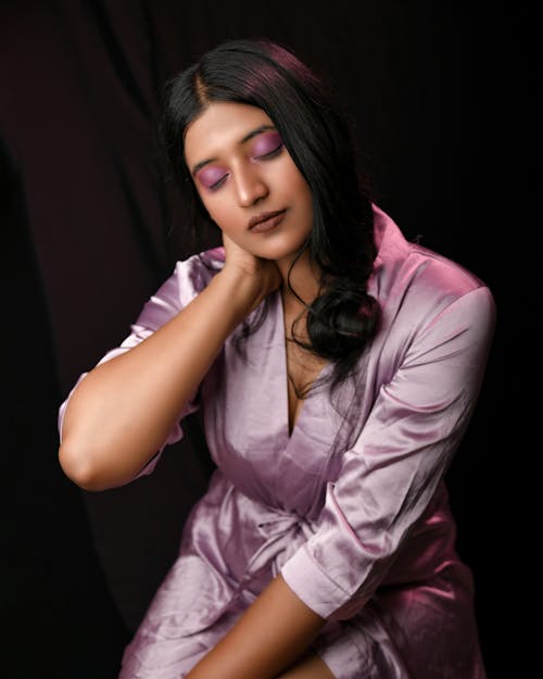 A Portrait of a Woman Posing while Eyes Closed