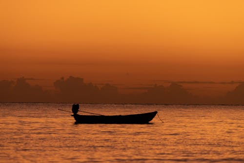 A Boat on the Sea During Golden Hour