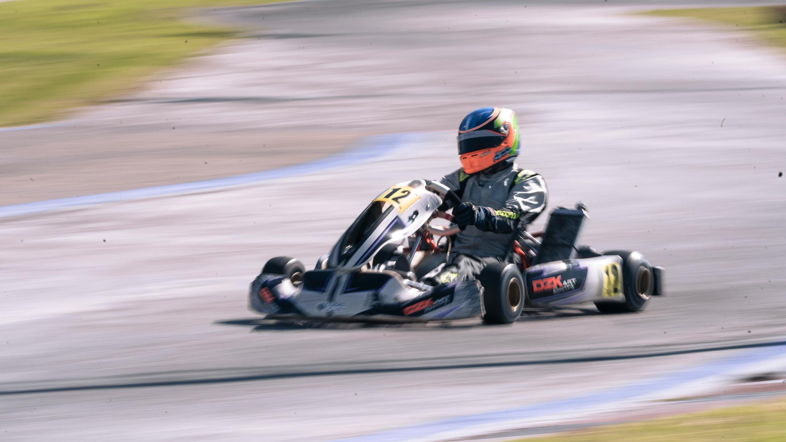 racer Driving a Fast Go Kart · Free Stock Photo