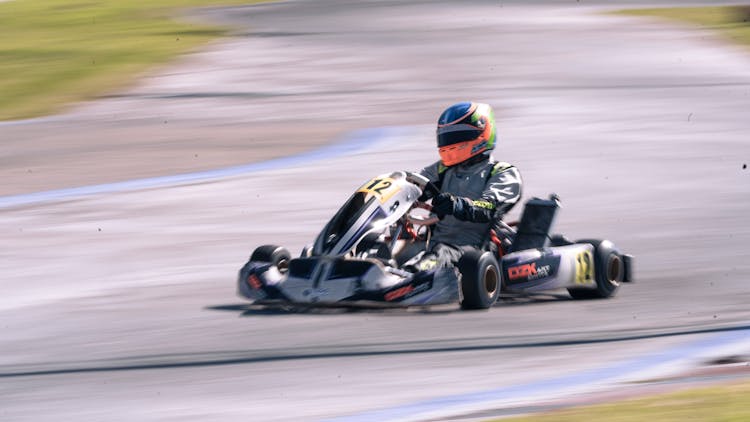 Racer Driving A Fast Go Kart