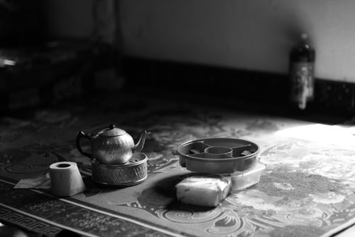 Free Elegant still life of a teapot and tableware in black and white. Stock Photo