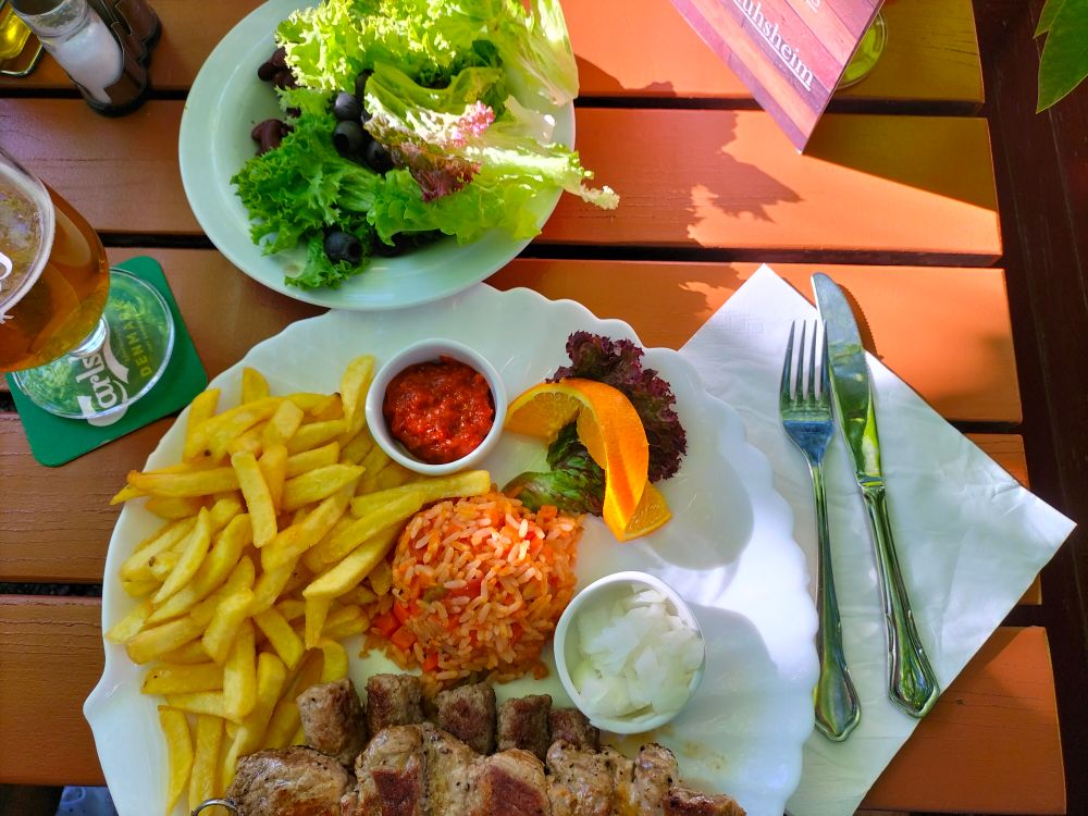 Eating Delicious Close-Up Shot of Delicious Food on Wooden Surface · Free Stock Photo
