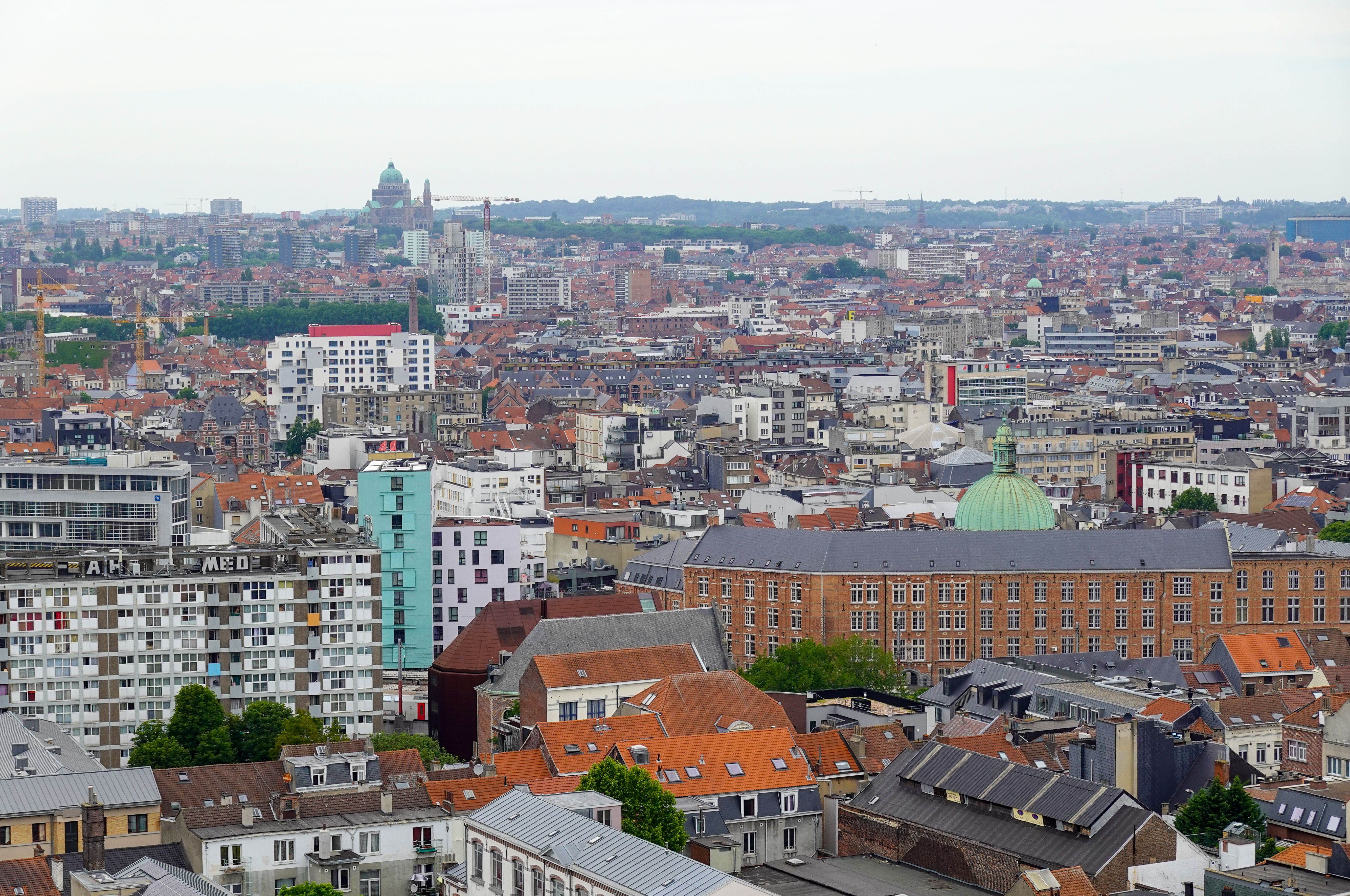 A vibrant aerial cityscape of Brussels showing iconic architecture and urban layout.