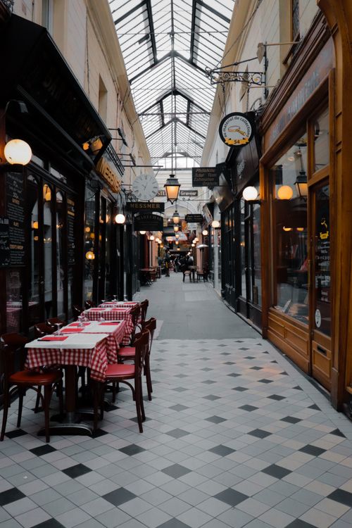 Free Discover the vintage charm of Passage des Panoramas in Paris, a historic arcade perfect for travel exploration. Stock Photo