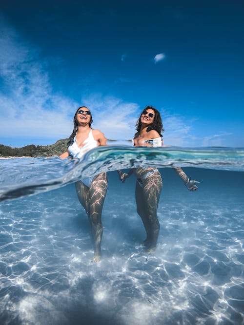 Free Smiling Girls in Bikini in Water Stock Photo