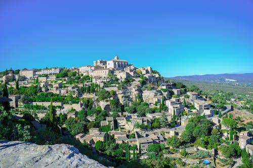 Clear Sky Over a Hillside Town in Summer