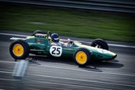 Timelapse Photography of Green and White Racing Vehicle on Lane