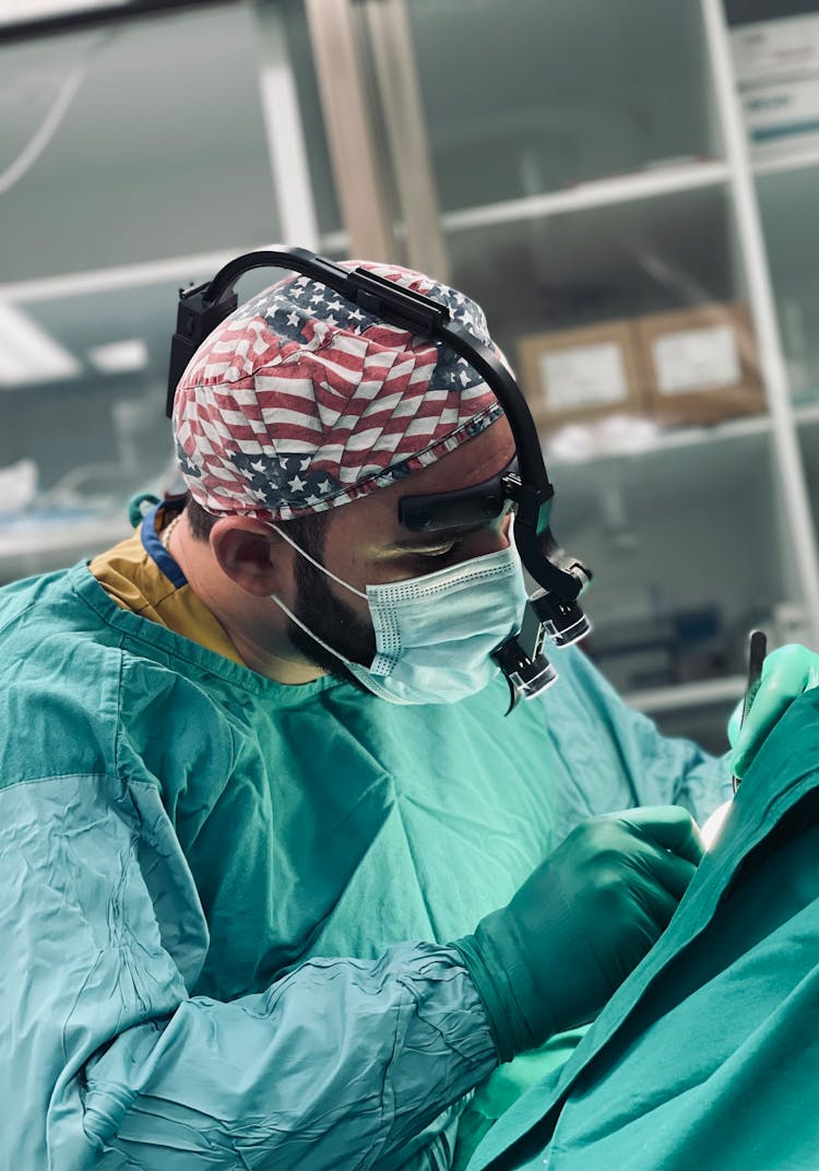 Doctor Operating In A Surgical Mask