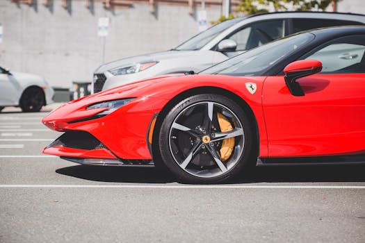 Side view of a red Ferrari SF90 Stradale parked outdoors in a parking lot.