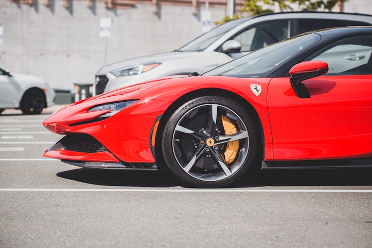 A Side View Of A Red Sports Car