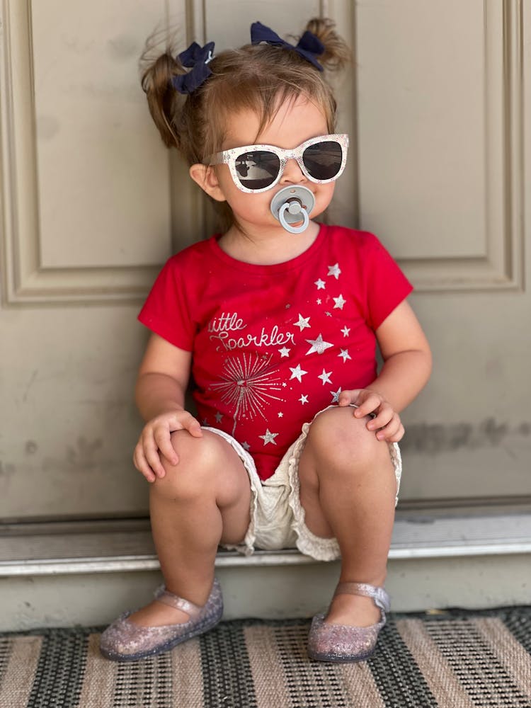 Cute Baby Girl With Pacifier And Sunglasses