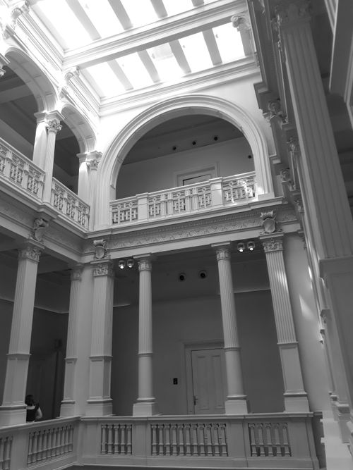 Free Captivating neoclassical interior with arches and columns in monochrome elegance. Stock Photo