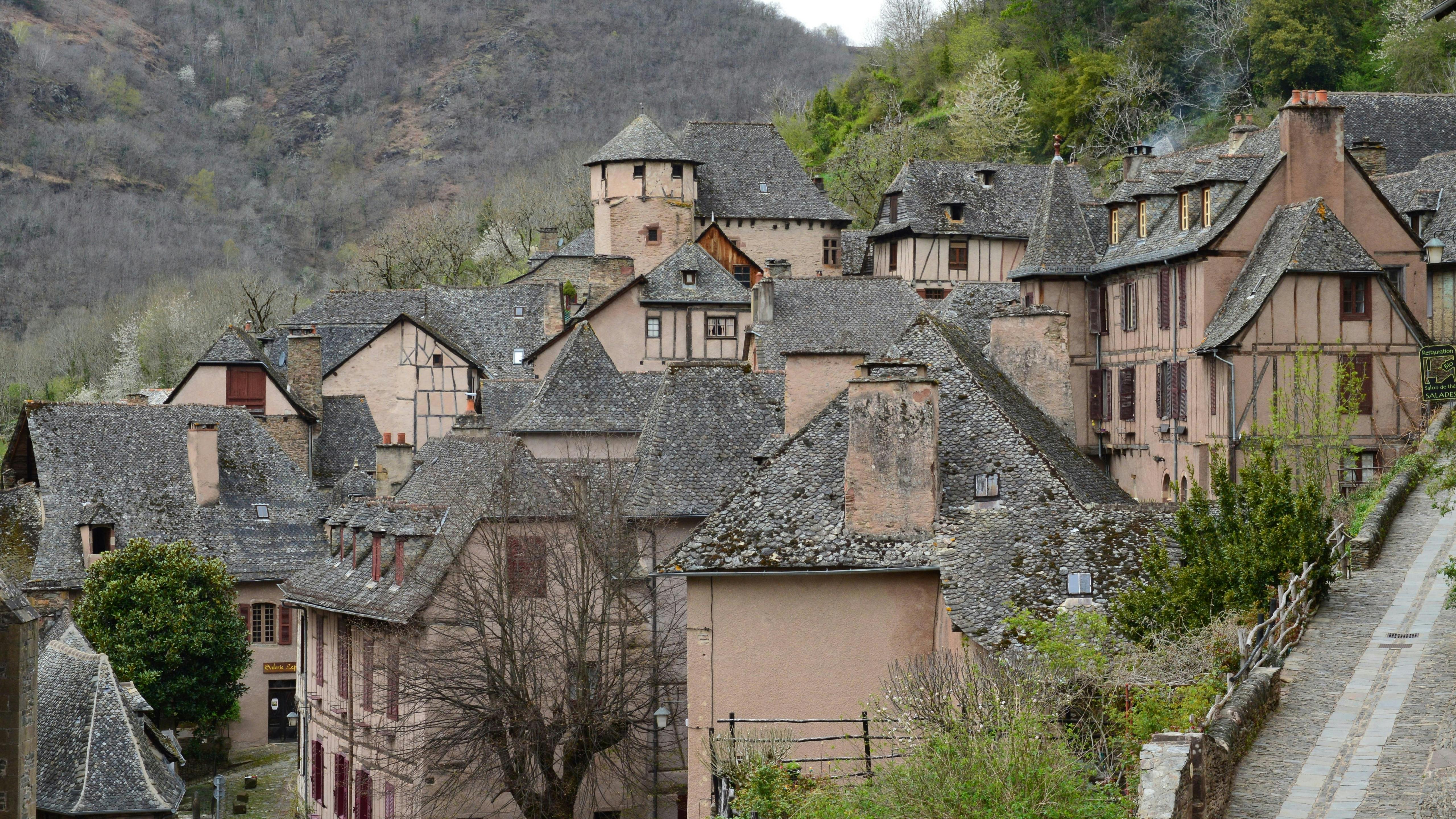 Explore this traditional medieval village with unique slate-roofed houses and stunning architecture.