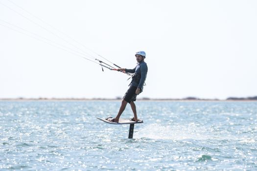 Man Kiteboarding on a Foilboard