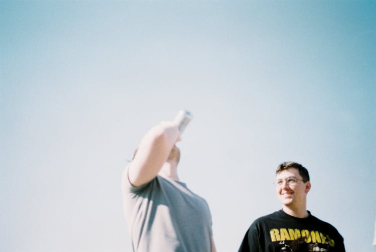 Man Drinking From Can