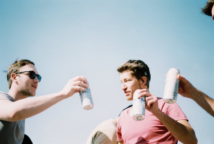 Men Drinking Beers In Can