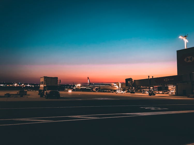 Airplane On Airport At Dawn