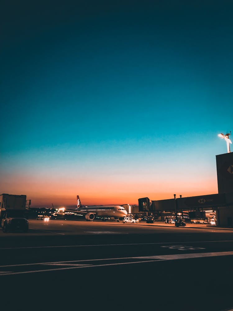 Airplane On Airport At Dusk