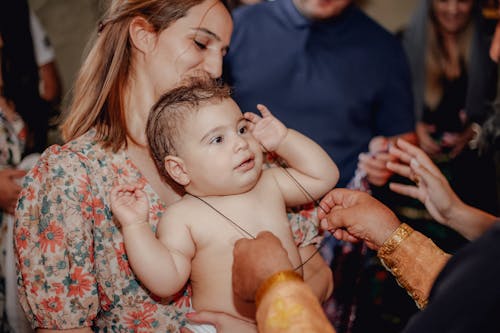 Woman Carrying a Baby Boy 