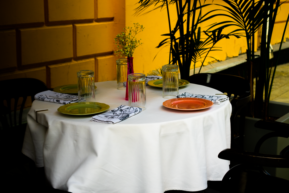 A brightly lit casual dining area in a Florida restaurant with several tables set for meals.