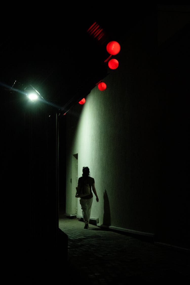 Person Walking Dark Street 