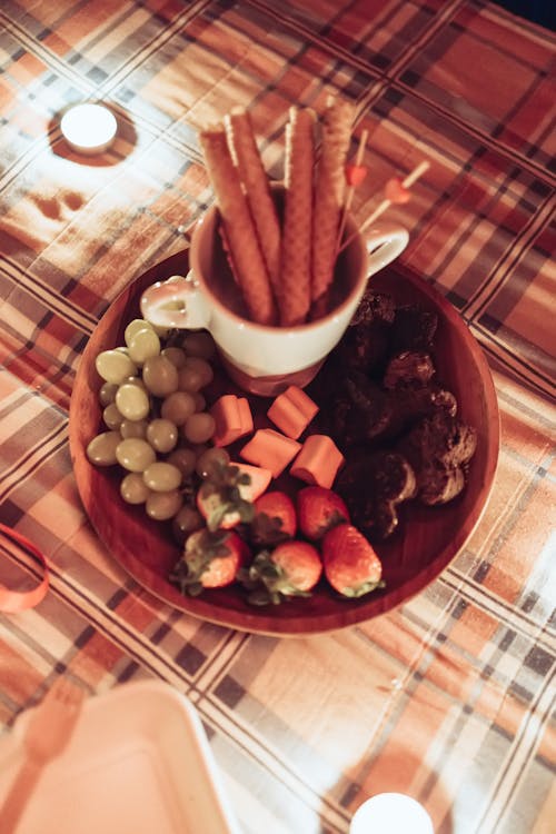 Top View of Fruits, Chocolate Cookies and Cinnamon Rolls 