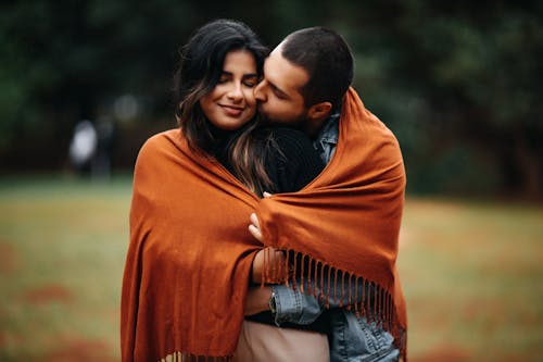 Portrait of a Couple Kissing and Embracing