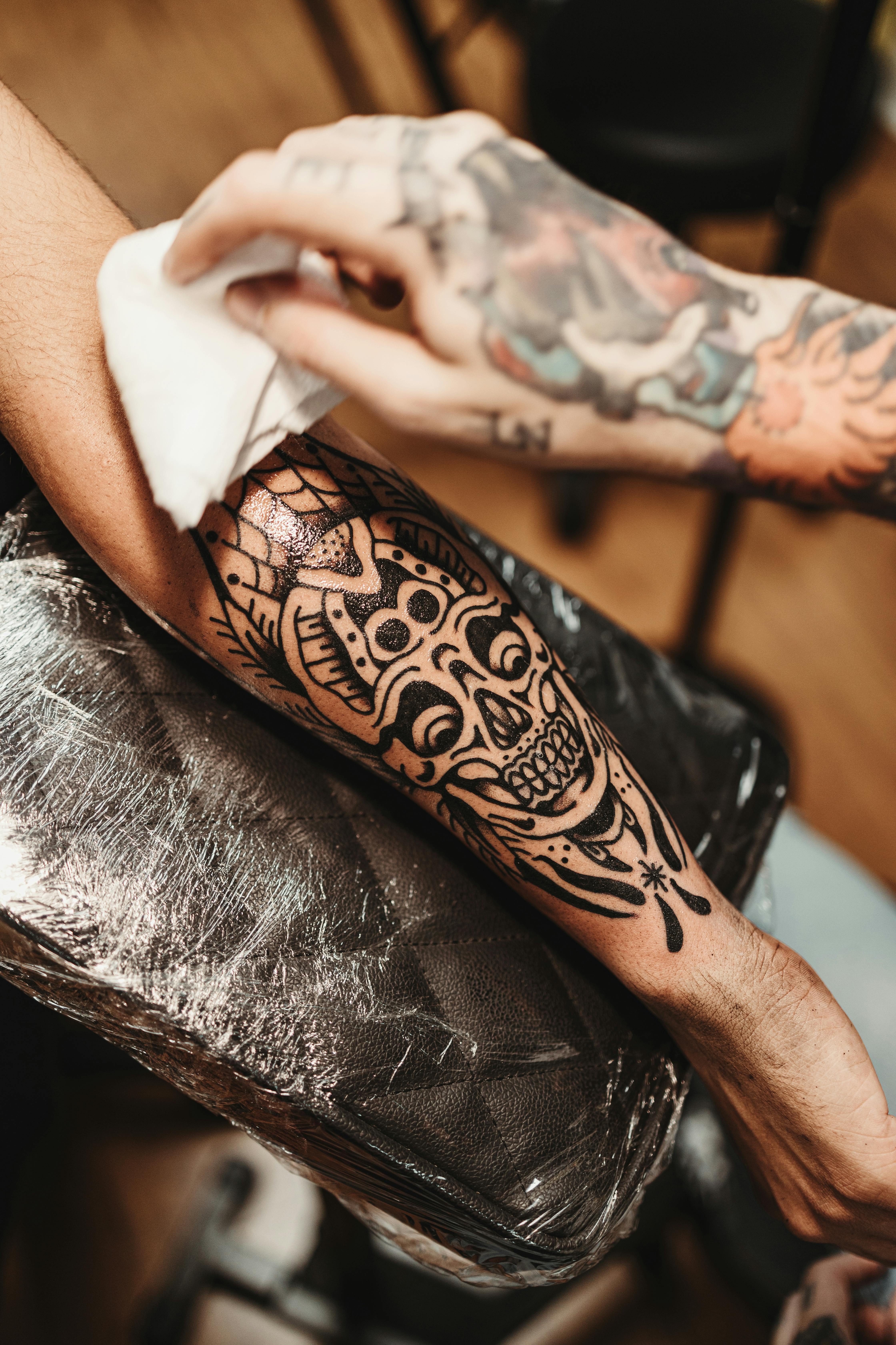 Skull Tattoo On The Arm Of A Man Free Stock Photo