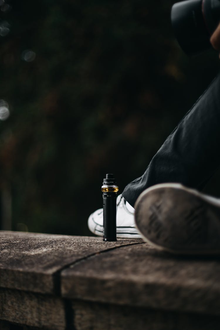 Sitting Person With Battery Flashlight