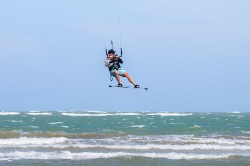 A Man Wakeboarding on the Sea