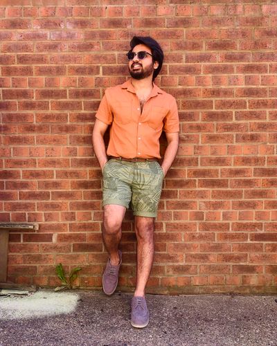 Man in a linen shirt and tailored shorts — photo by Naveen sita on Pexels