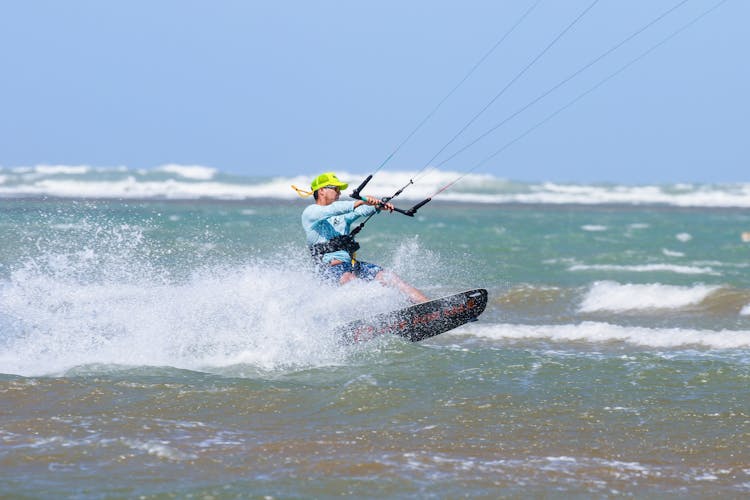 Man Windsurfing At Sea