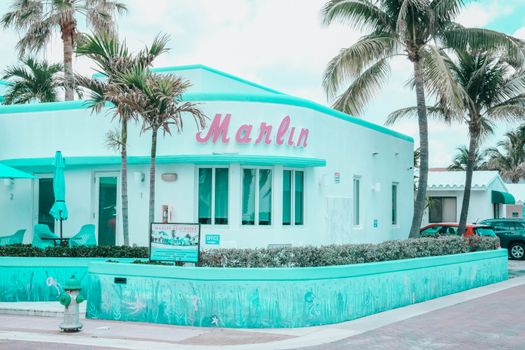 A Blue Building Near Palm Trees