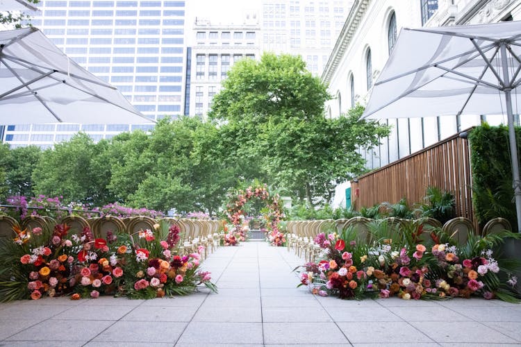 An Outdoor Wedding Venue With Flower Arrangement