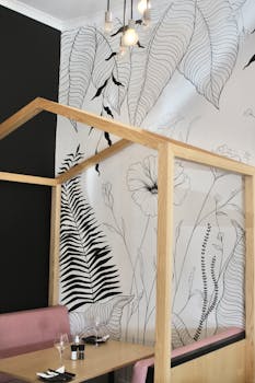 Chic cafe interior featuring minimalist decor and artistic botanical wall art in Randburg, South Africa.