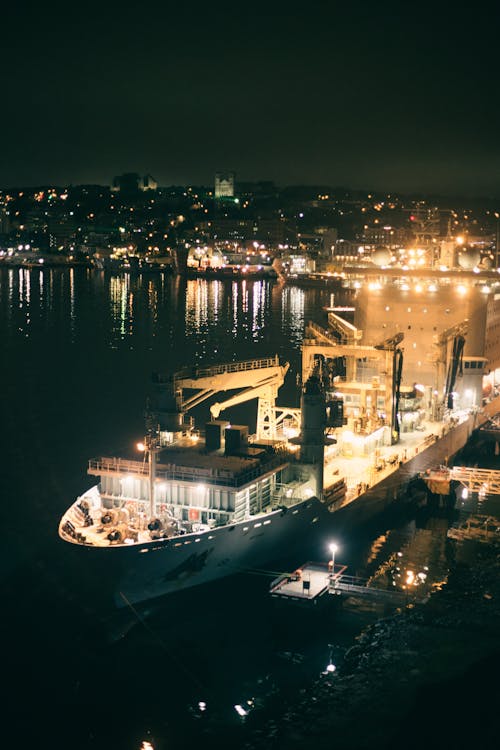 Cargo Ship Docked on the Port at Night Time