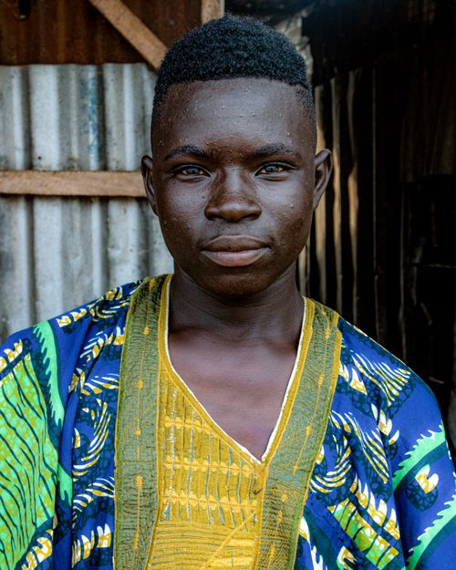 Free A young Tanzanian man wearing vibrant traditional clothing in Rujewa, Iringa Region. Stock Photo