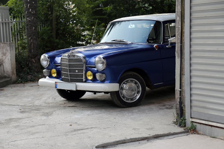 Vintage Car Parked Behind Building Corner