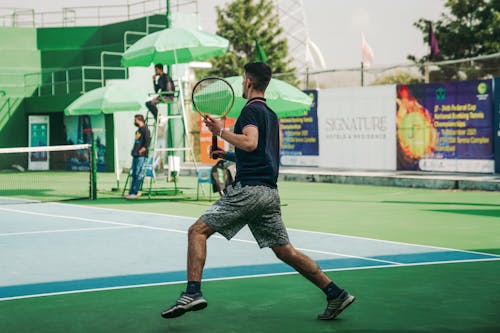 A Man Playing Tennis