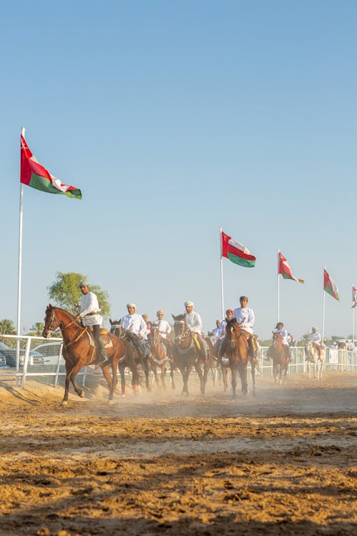 People Horseback Riding