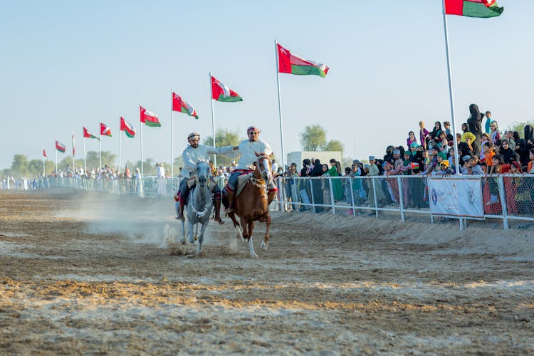 Men Racing On Horses 